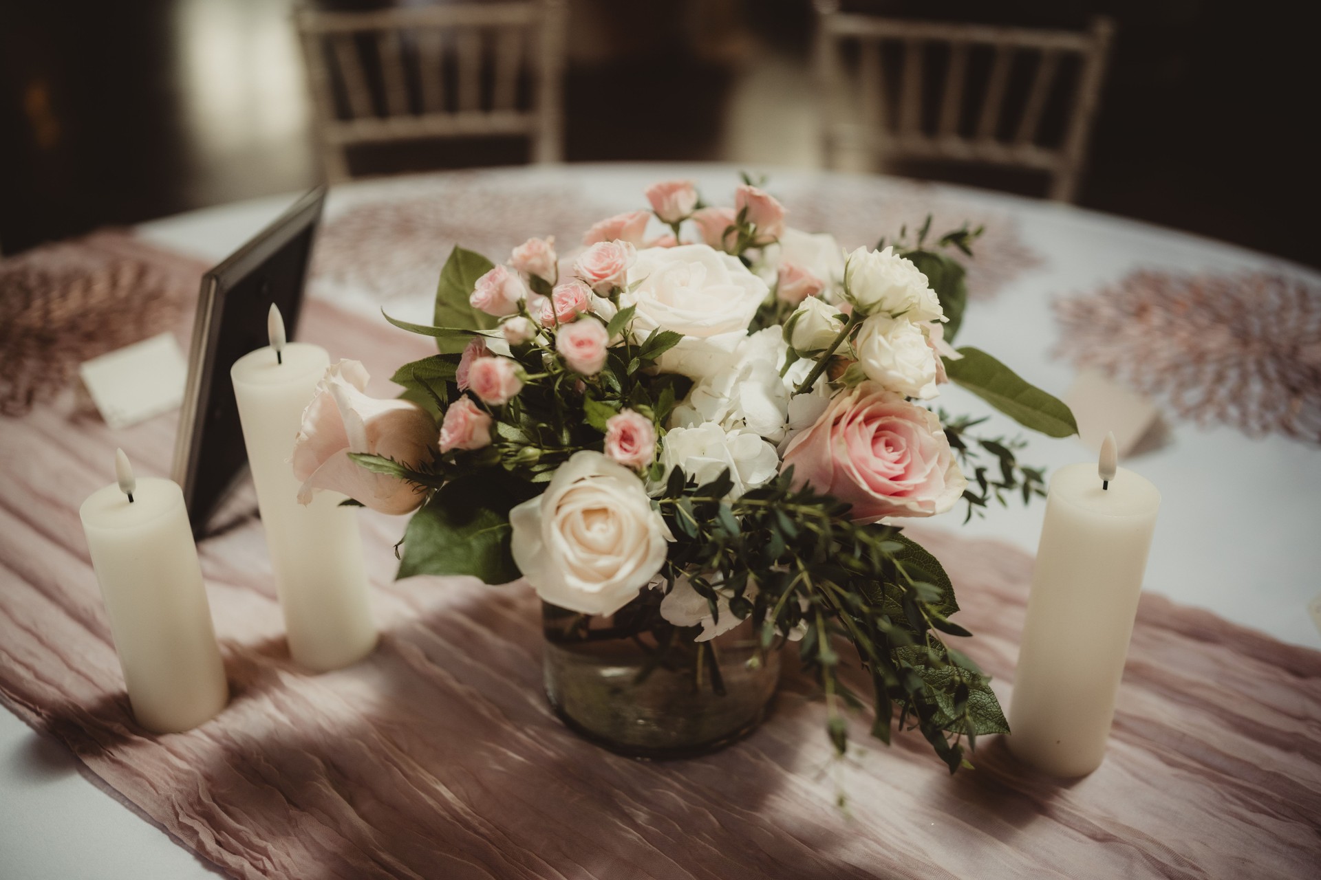 Wedding reception flower arrangement centerpiece with white and pink roses